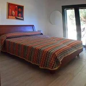 A bed or beds in a room at Casa Polinisso