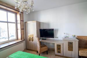 TV a/nebo společenská místnost v ubytování Apartamenty Gdynia City Center