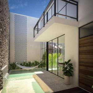 a house with a hammock and a swimming pool at La peregrina in Mérida +15 photos
