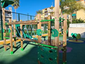 a playground with a slide in a park at Casa Tumry in Denia