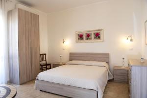 Letto o letti in una camera di B&B I Gerani