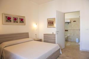 Letto o letti in una camera di B&B I Gerani