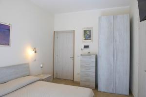 Letto o letti in una camera di B&B I Gerani