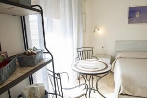 Letto o letti in una camera di B&B I Gerani