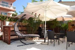 A patio or other outdoor area at Plaisir Rooms