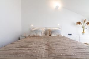 Ένα ή περισσότερα κρεβάτια σε δωμάτιο στο Lovely Nida Studio