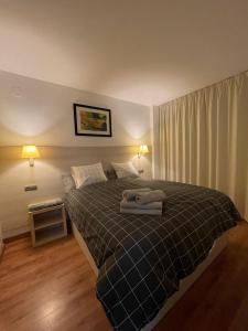 A bed or beds in a room at Apartamento Michelangelo