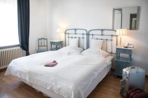 En eller flere senge i et værelse på Haus Isabel