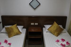 Cama o camas de una habitación en Blue Lotus Hotel