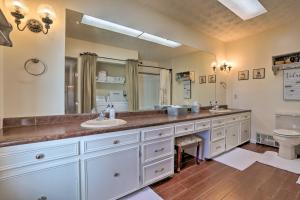 a bathroom with two sinks and a large mirror at Charming East Bernstadt Retreat Less Than 6 Acre Farm! in East Bernstadt