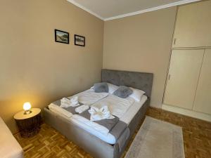 Posteľ alebo postele v izbe v ubytovaní Alexandra Apartman