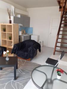 a living room with a bed and a glass table at ΜΑΡΓΑΡΙΤΑ in Salamina