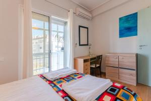Postel nebo postele na pokoji v ubytování Paço de Arcos Apartment