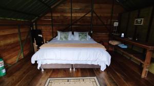Katil atau katil-katil dalam bilik di Ecohotel Pinohermoso Reserva Natural