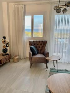 Area tempat duduk di Sweetness Apartment By the Sea