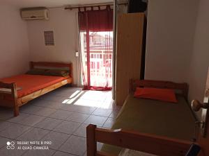 Postel nebo postele na pokoji v ubytování Savvas