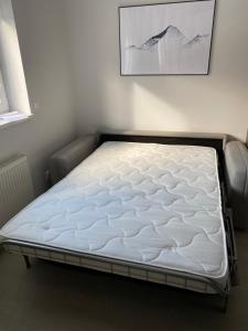 a mattress on a bed frame in a room at Apartmán v Koutech in Kouty