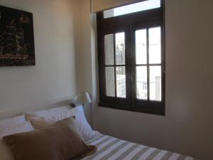Кровать или кровати в номере Apartamentos en el palacio salvo