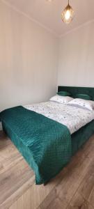 Posteľ alebo postele v izbe v ubytovaní Nest Apartament