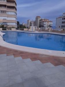 a large blue swimming pool on top of a building at Aurora BeachHouse 300m from the beach with large beaitiful terrace in Arenales del Sol
