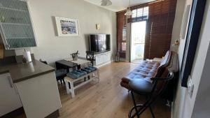 TV a/nebo společenská místnost v ubytování Apartamento en Playa del Ingles CC Yumbo