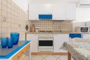 Kuchyň nebo kuchyňský kout v ubytování Domo Coro e Bentu
