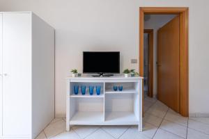 TV a/nebo společenská místnost v ubytování Domo Coro e Bentu