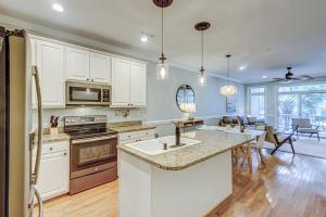 a kitchen with white cabinets and a counter top at Turtle Bay 5 in Folly Beach