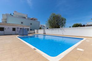 a swimming pool in the backyard of a villa at Casa do Afonso Cabanas Beach in Cabanas de Tavira