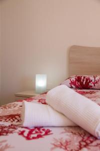 A bed or beds in a room at BluRiva Hotel