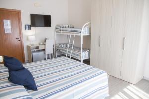 A bed or beds in a room at BluRiva Hotel
