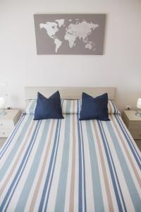 A bed or beds in a room at BluRiva Hotel