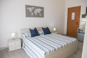 A bed or beds in a room at BluRiva Hotel
