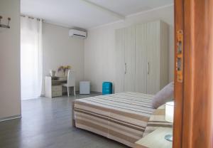 A bed or beds in a room at BluRiva Hotel