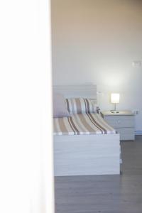 A bed or beds in a room at BluRiva Hotel