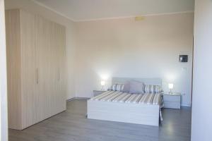 A bed or beds in a room at BluRiva Hotel