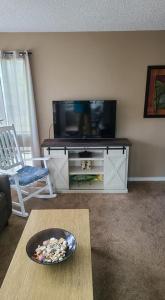 A television and/or entertainment centre at Spencer's Myrtle Beach Rental at Arcadian Dunes