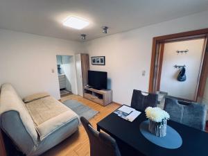 Televízia a/alebo spoločenská miestnosť v ubytovaní Apartment Ausseerland - willkommen bei Freunden