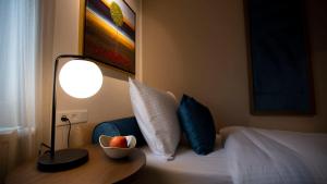 Giường trong phòng chung tại Delphi Hotel & Restaurant