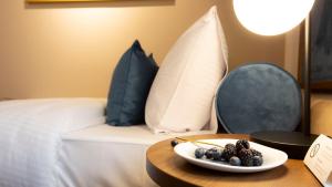 Giường trong phòng chung tại Delphi Hotel & Restaurant