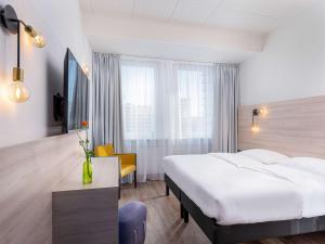 Postel nebo postele na pokoji v ubytování greet Berlin Alexanderplatz