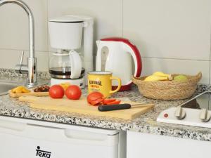 A kitchen or kitchenette at FLOR los Almendros Apartamentos