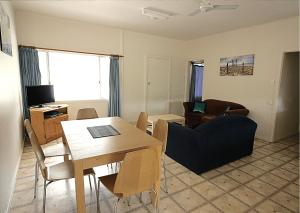 a living room with a table and a couch at Kangaroo Island Coastal Villas in American River