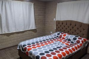 Een bed of bedden in een kamer bij Los Lagos