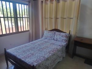 מיטה או מיטות בחדר ב-Hostal Green Bay