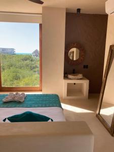 Postel nebo postele na pokoji v ubytování Tikul Hotel Boutique