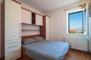 Postel nebo postele na pokoji v ubytování Apartment Irena
