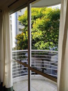 a view of a balcony from a window at Alquiler Balcarce in Rosario