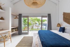 Postel nebo postele na pokoji v ubytování Jepun Sari Uluwatu