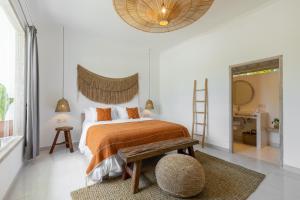 Postel nebo postele na pokoji v ubytování Jepun Sari Uluwatu